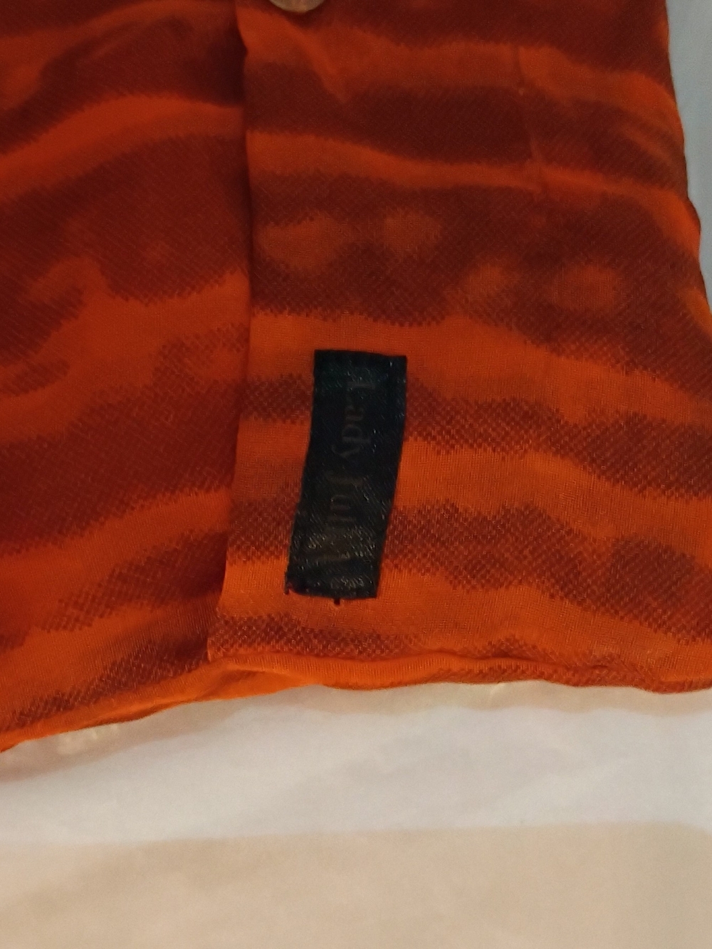 Bright Orange Striped Sleeveless Top with Black Brand Tag